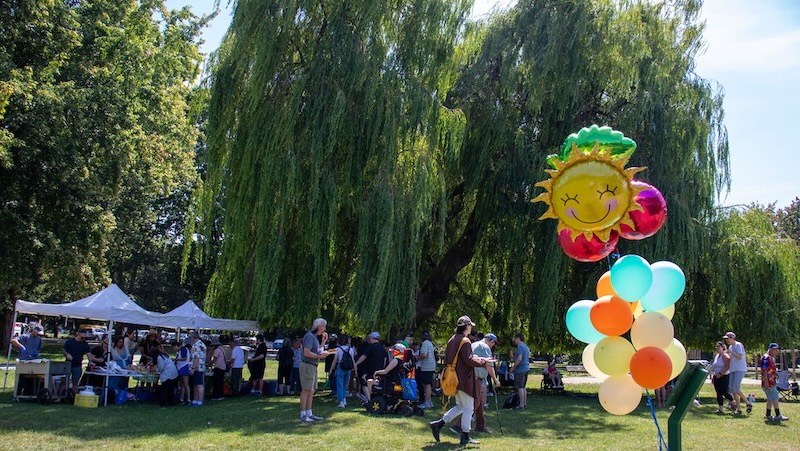 Trout Lake Gazebo on Sunny Day with many people at Spectrum Picnic